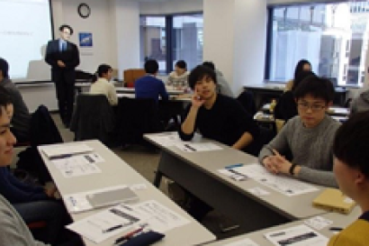 Students sit around table at SAF Japan Career Readiness Workshop