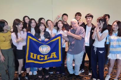 UCLA Extension Study Tour Certificate Ceremony (2025) - group photo of students holding flag
